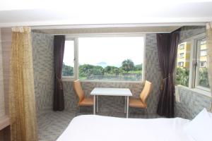 A bed or beds in a room at Sea Keelung 61