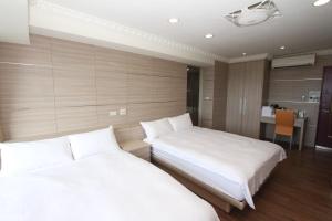A bed or beds in a room at Sea Keelung 61