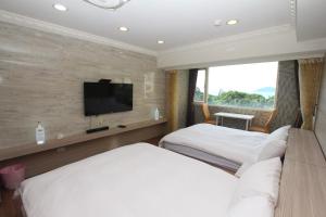 A bed or beds in a room at Sea Keelung 61
