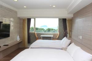 A bed or beds in a room at Sea Keelung 61