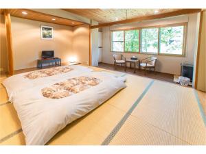 Postel nebo postele na pokoji v ubytování Nomad Hakuba + 32 fotografií