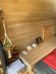 a small room with a bed and a wooden wall at Blue-S Hotel & Apartment in Da Nang