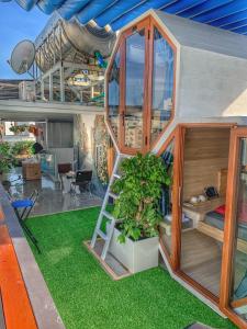a small house with a ladder and a plant in it at Blue-S Hotel & Apartment in Da Nang
