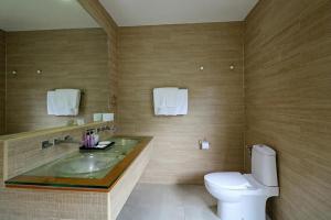 a bathroom with a sink and a toilet at Samui Boat Lagoon in Choeng Mon Beach