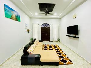 Μια τηλεόραση ή/και κέντρο ψυχαγωγίας στο Aurora Homestay TRG