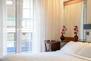 Posteľ alebo postele v izbe v ubytovaní Victory Inn Hotel