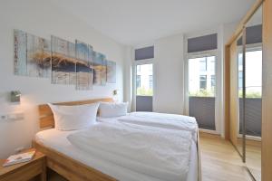 Ένα ή περισσότερα κρεβάτια σε δωμάτιο στο Ferienwohnung Sonnenterrasse