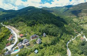 an aerial view of a house in the mountains at Neva Apartments in Mokra Gora