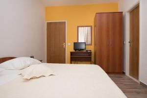 Кровать или кровати в номере Apartments Lovrić