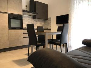 Kuchyň nebo kuchyňský kout v ubytování Hotel Est Piombino