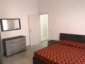 Postel nebo postele na pokoji v ubytování Hotel Est Piombino