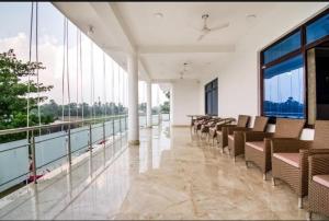 a room with a row of chairs in a building at Shree R.C.VATIKA in Motīhāri