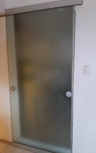 a sliding glass door of a refrigerator at My Last Resort - Study in Lima