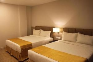 Postel nebo postele na pokoji v ubytování NU Hotel @ KL Sentral