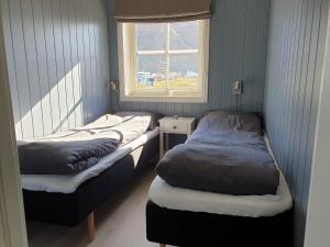 Llit o llits en una habitació de Bensvik Brygge