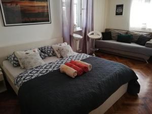 a bedroom with a bed with pillows on it at Optimist split/city center in Split
