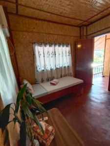 Postel nebo postele na pokoji v ubytování Purple Homestay Hillside