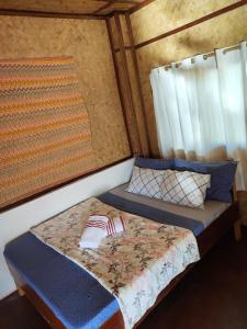 Postel nebo postele na pokoji v ubytování Purple Homestay Hillside