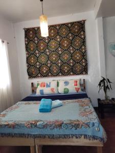 Postel nebo postele na pokoji v ubytování Purple Homestay Hillside