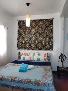 Postel nebo postele na pokoji v ubytování Purple Homestay Hillside