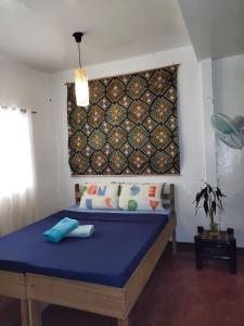 Postel nebo postele na pokoji v ubytování Purple Homestay Hillside