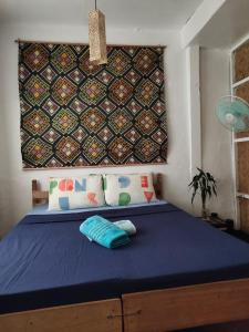 Postel nebo postele na pokoji v ubytování Purple Homestay Hillside