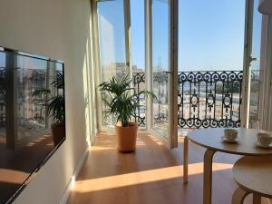 a balcony with a table and a view of a city at Vivienda Bendicho- CATEDRAL in Almería