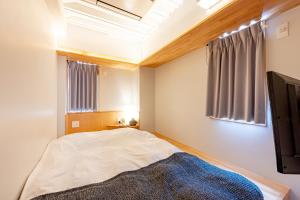 Postel nebo postele na pokoji v ubytování plat hostel keikyu asakusa station