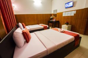 TV a/nebo společenská místnost v ubytování Botoum Hotel