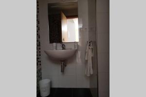 Koupelna v ubytování Apartamento Aldara a escasos metros de la playa + 19 fotografií