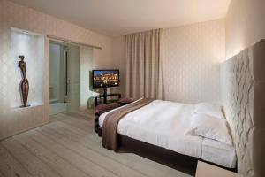 Letto o letti in una camera di Base Hotel
