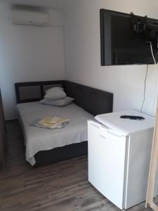 Postel nebo postele na pokoji v ubytování Sunshine Apartments