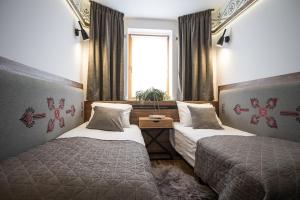 Posteľ alebo postele v izbe v ubytovaní Apart-Center Pod Orłem