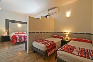 Postel nebo postele na pokoji v ubytování Golfe Hôtel & Spa Porto-Vecchio