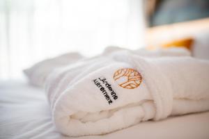 Postel nebo postele na pokoji v ubytování L'Ardenne Autrement Wellness include