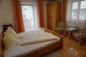 Postel nebo postele na pokoji v ubytování Musikhof Lexer