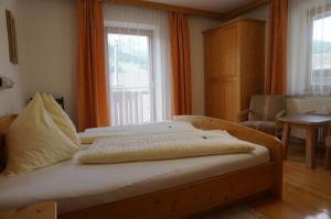 Postel nebo postele na pokoji v ubytování Musikhof Lexer