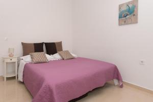 Кровать или кровати в номере Apartments Lovrić