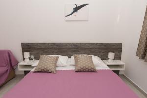 Кровать или кровати в номере Apartments Lovrić