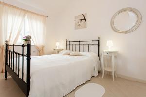 Postel nebo postele na pokoji v ubytování VILLA BIANCHERA + 19 fotografií