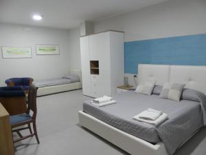 Rúm í herbergi á Albergo Piazza Risorgimento