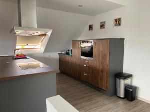 Kuchyň nebo kuchyňský kout v ubytování Traumhafte Dachgeschosswohnung + 16 fotografií