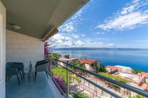 a balcony with a view of the water at Apartments Mia in Omiš