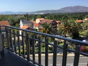 a view of a city from a balcony at Apartamento Playa de Carnota in Carnota