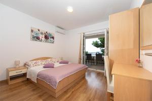 Posteľ alebo postele v izbe v ubytovaní Apartmani Vice