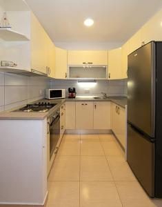 Kuchyňa alebo kuchynka v ubytovaní Apartmani Vice