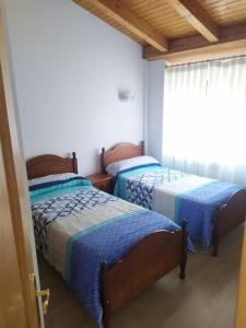 Posteľ alebo postele v izbe v ubytovaní La Laguna