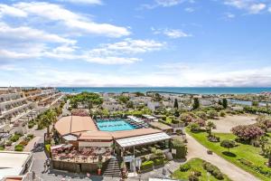 an aerial view of the resort with the ocean in the background at LE DONJON Villa BDSM Port Nature VILLAGE Cap d'Agde naturiste in Cap d'Agde +7 photos