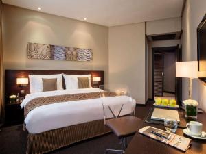 Säng eller sängar i ett rum på Mövenpick Hotel Casablanca