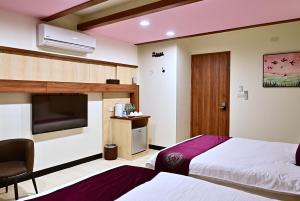 Krevet ili kreveti u jedinici u objektu Hotel Yong Cheng